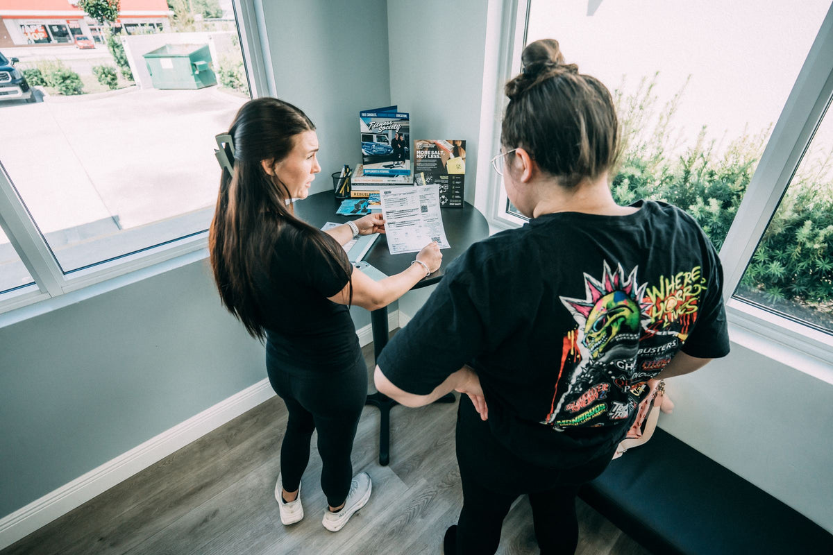 Coach reviewing InBody scan results with a new client