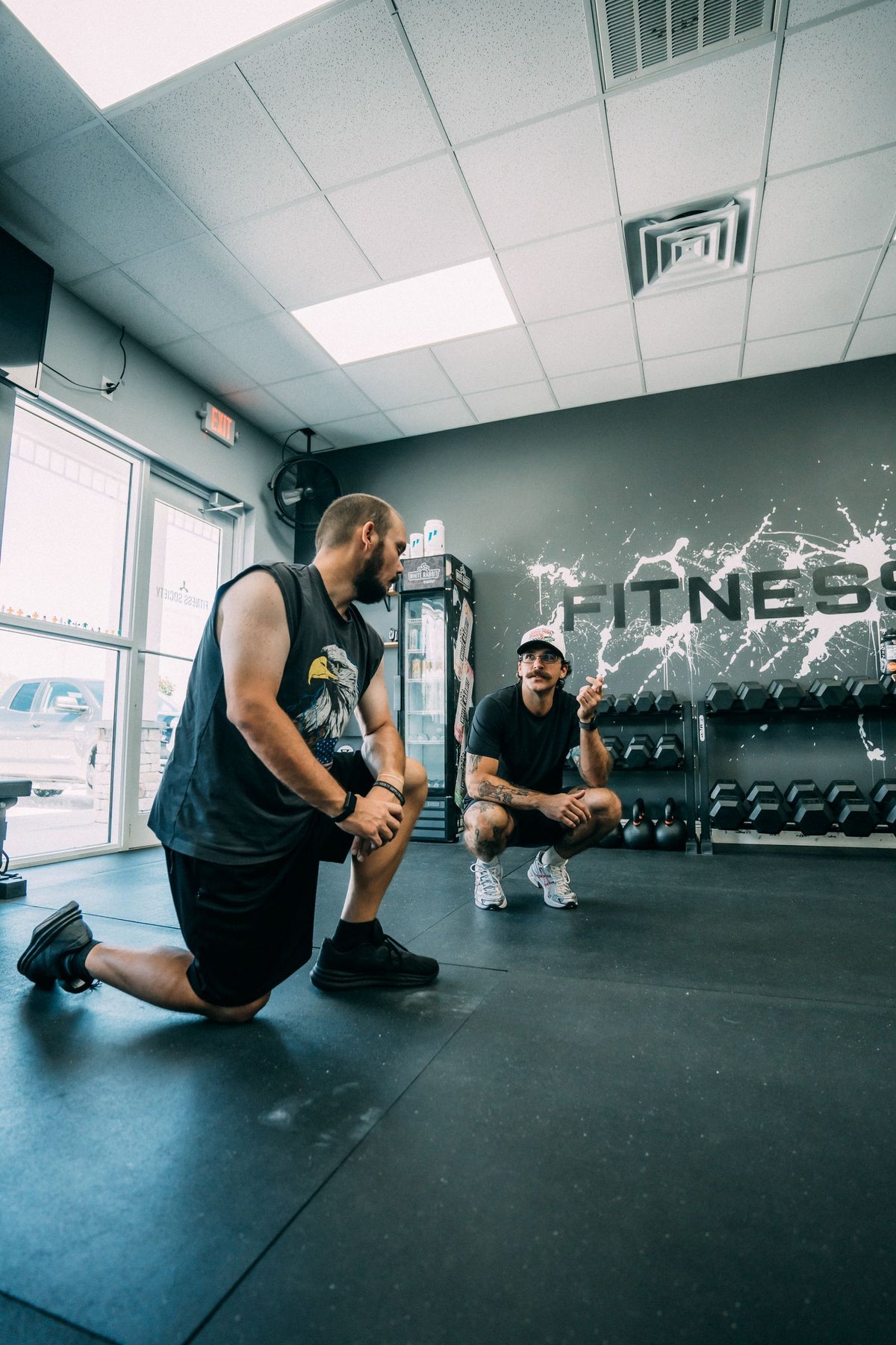 Coach coaching a lunge variation at the Melbourne studio