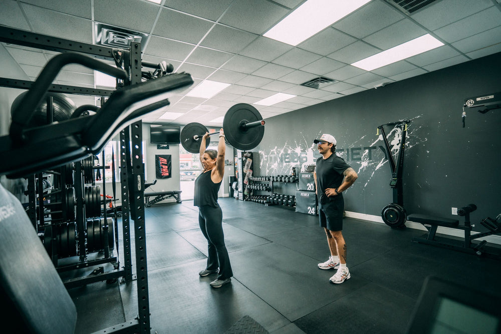 Wide view of a coached strength session in the Melbourne, FL studio